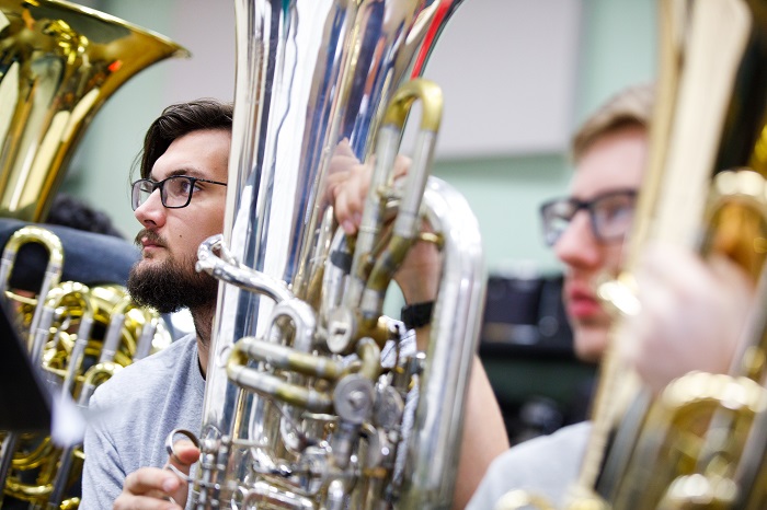 Music students learning in the classroom.