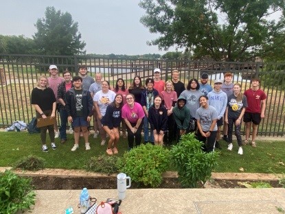 Students at a Saturday community garden work day. 