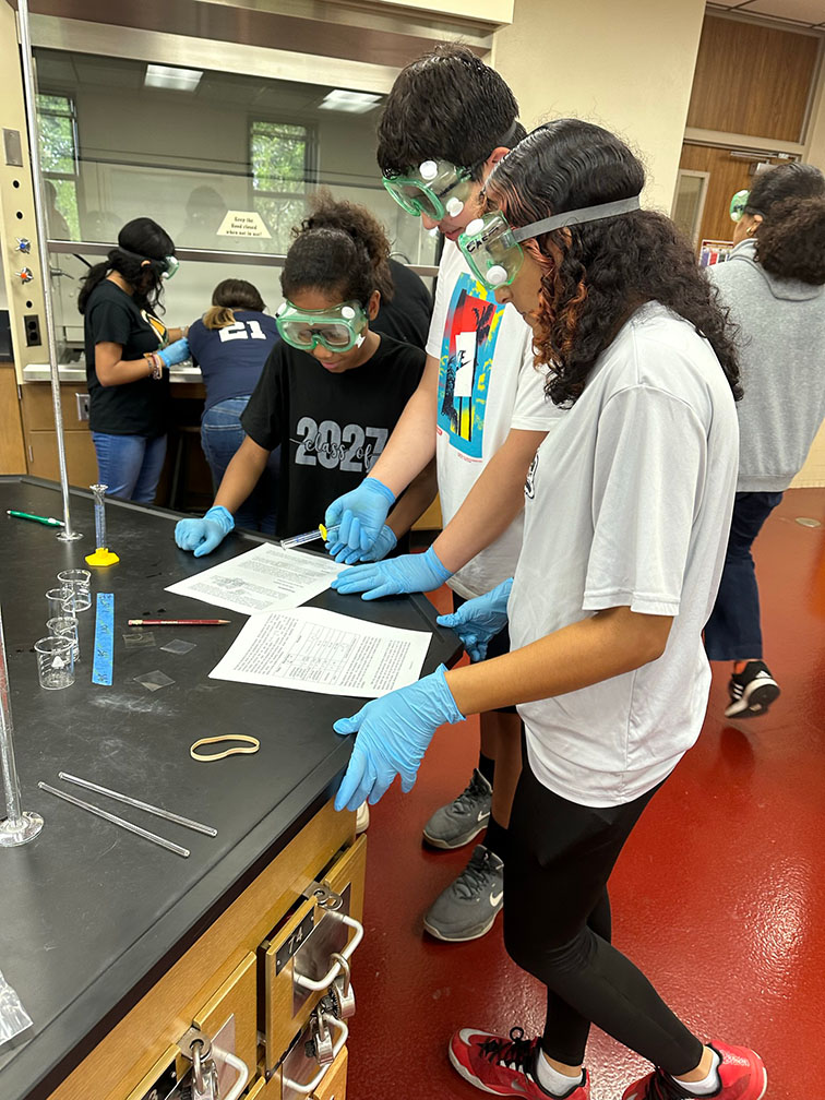 Students working together in a lab during the American Chemical Society road to college event.