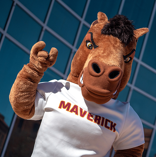 Maverick T. Mustang, the MSU Texas mascot, outside of the Centennial Hall building.