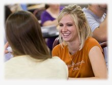 Photo of student smiling in cafeteria