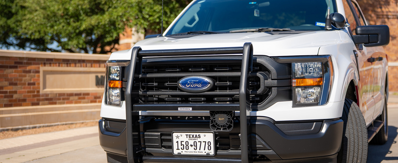 An MSU Texas Police Department truck is parked near West College of Education