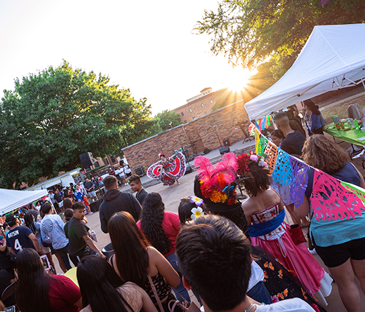 A group of students watch as another performs during Hispanic Heritage Month.